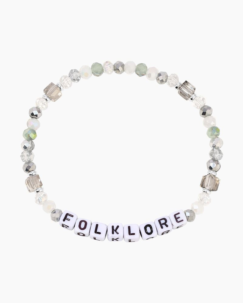 taylor swift folklore bracelet on a white background