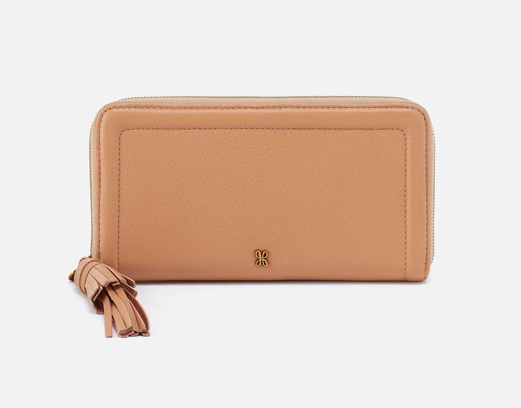 nila large zip around continental wallet in sandstorm on a white background