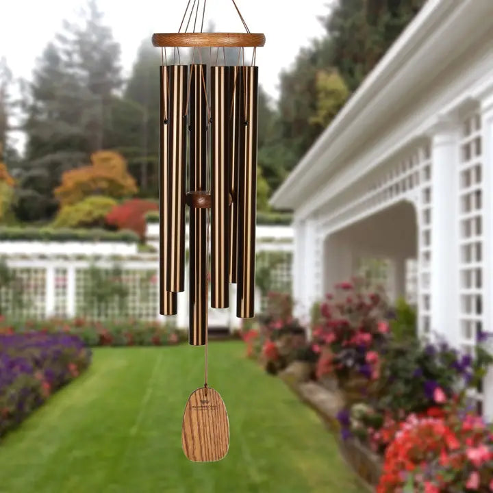 wind chime with a outdoor garden in the background