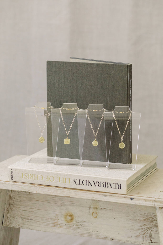 multiple bracelets on a gray and white background