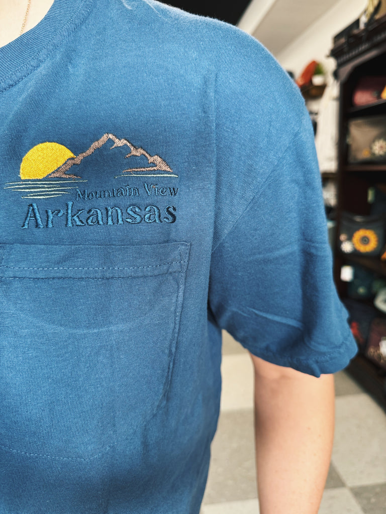 embroidered pocket tee being worn in a store