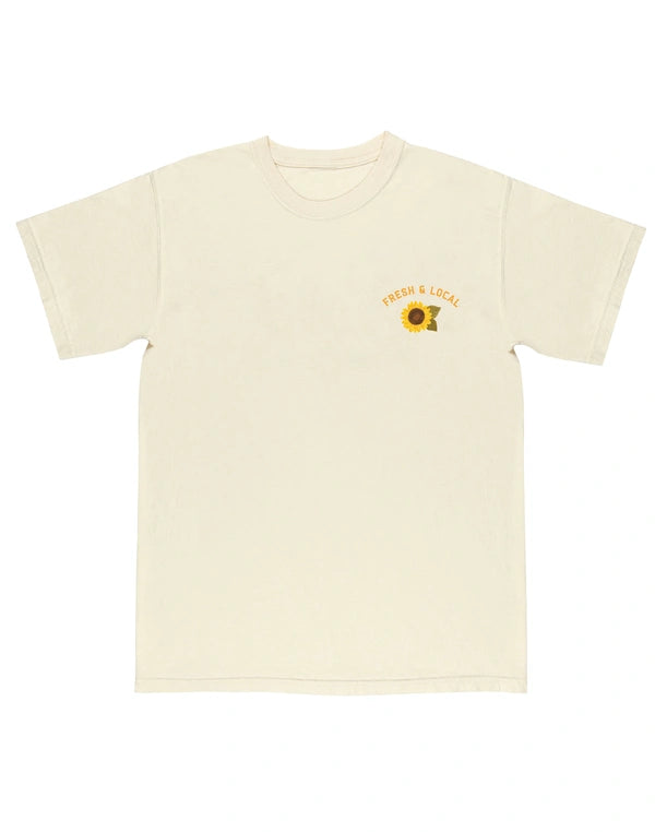 Beige t-shirt with a sunflower graphic and text on a white background