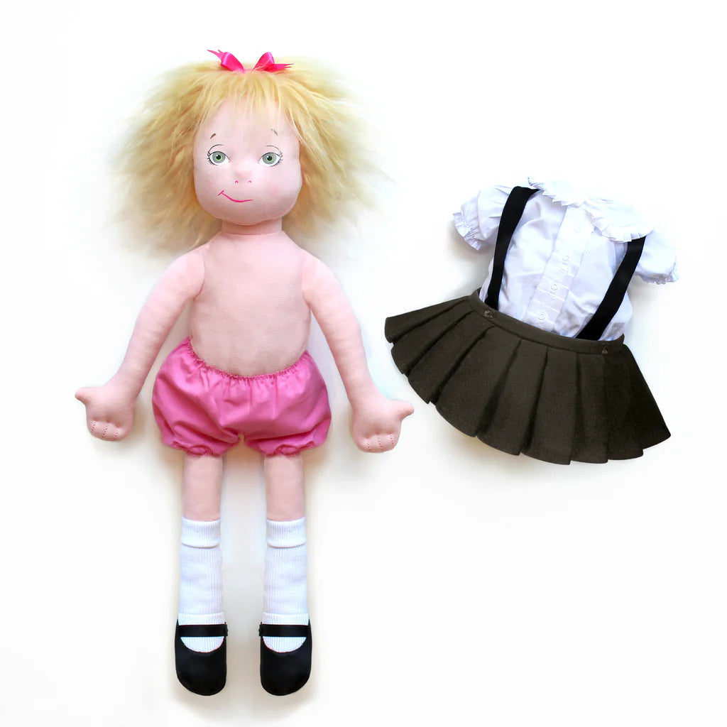 Blank doll with blonde hair, pink shorts, and black shoes next to a school uniform on a white background