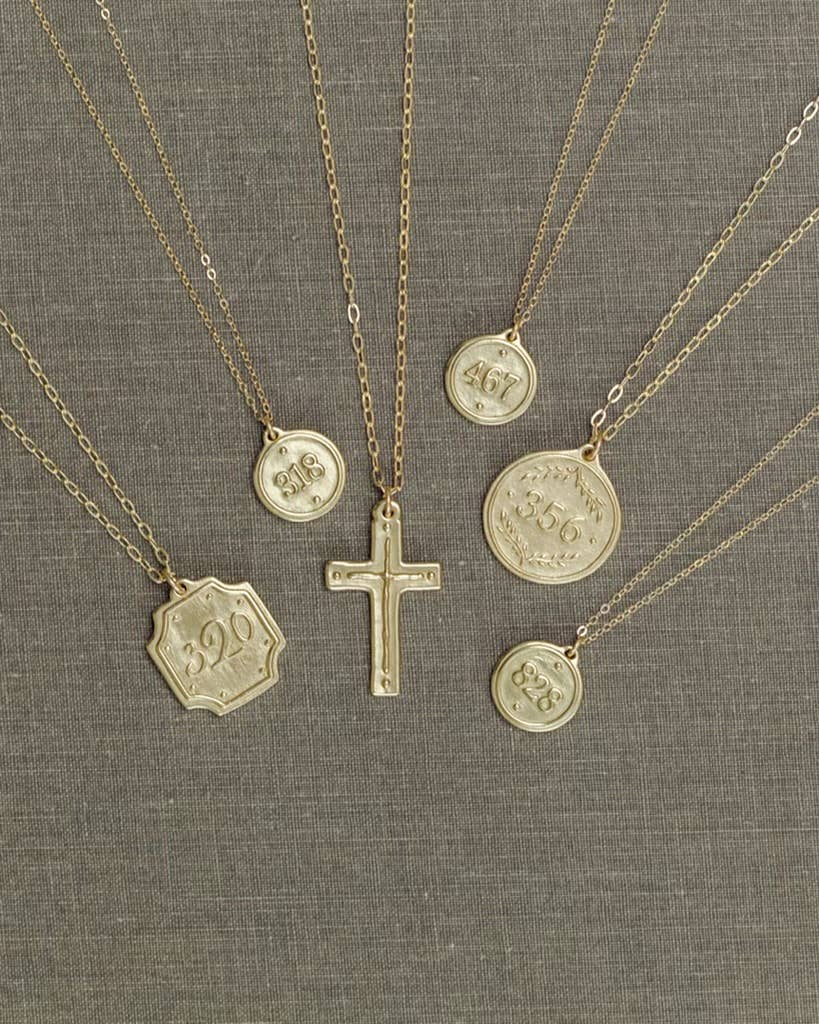 multiple necklaces on a gray background