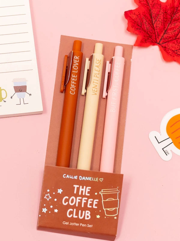Set of pens with a 'The Coffee Club' packaging on a pink background