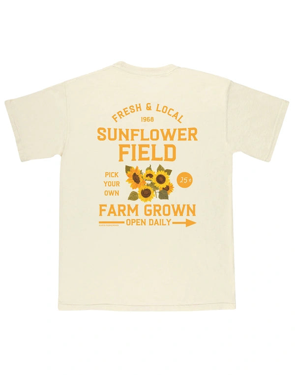 Beige t-shirt with sunflower graphic and text on a white background