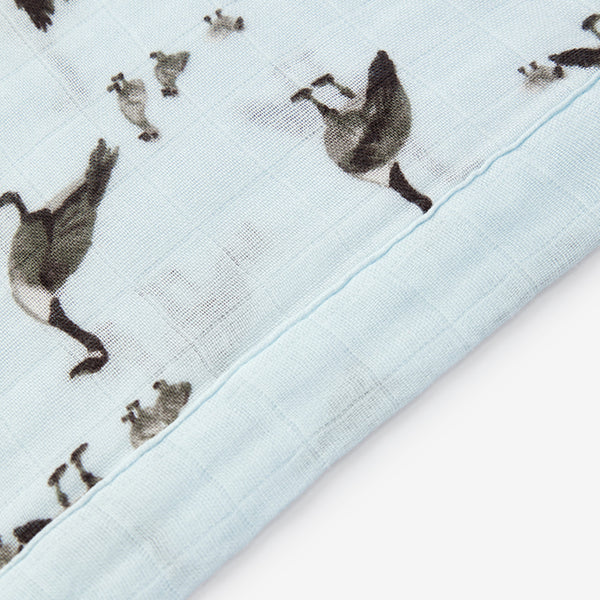 milkbarn goose mini lovey up close to show the stitching of the lovey on a white background