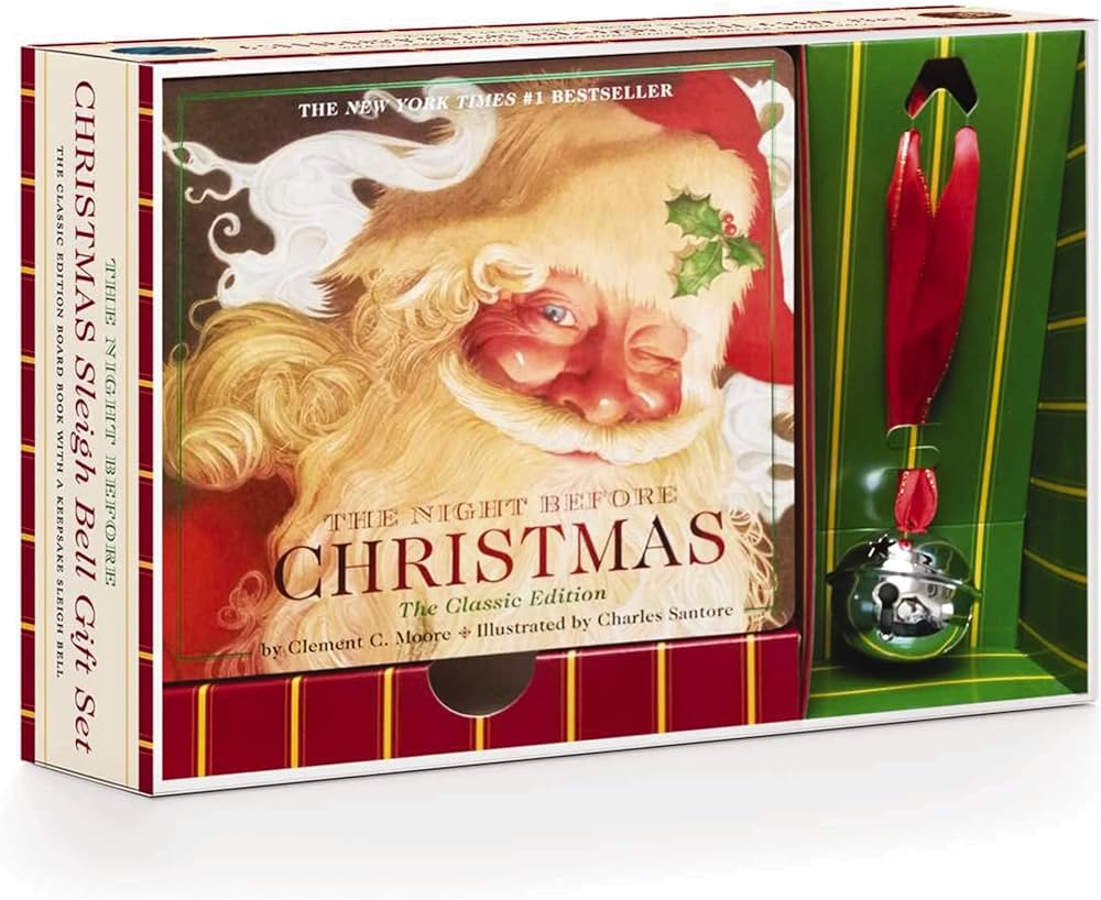 the night before christmas book and sleigh bell set on a white background