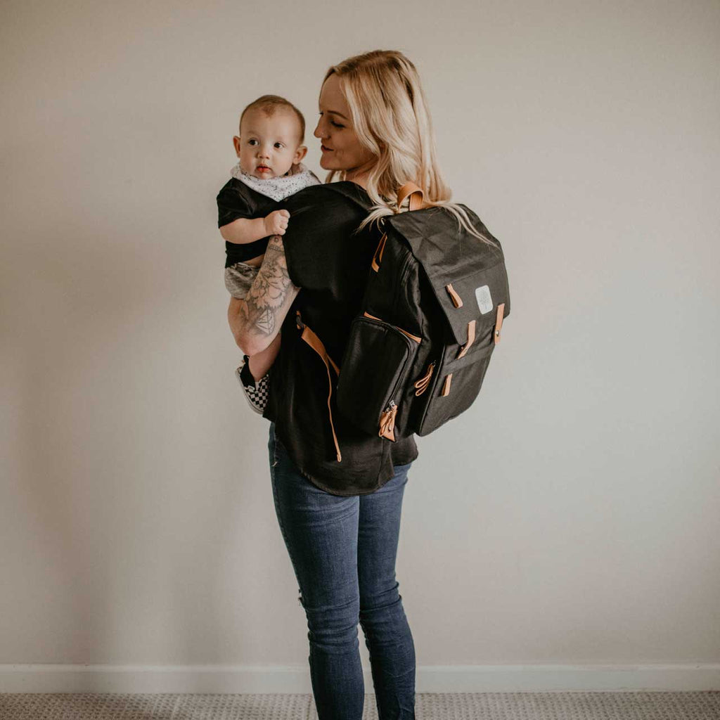 black diaper bag on a white background