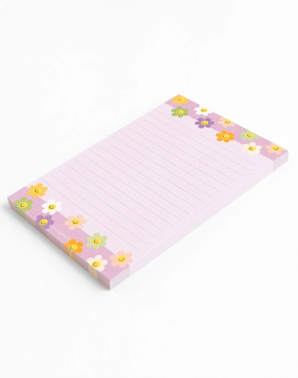 Notepad with floral design on a white background