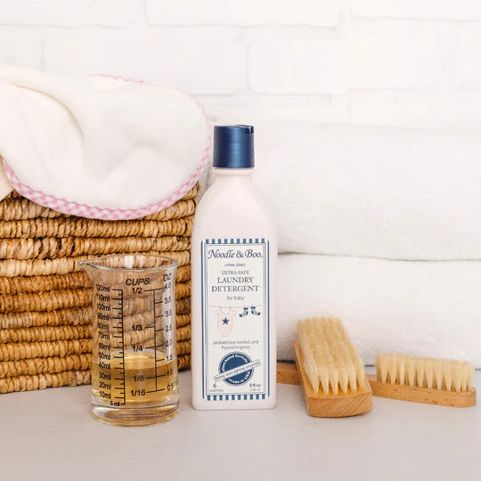 noodle and boo laundry detergent on a white background