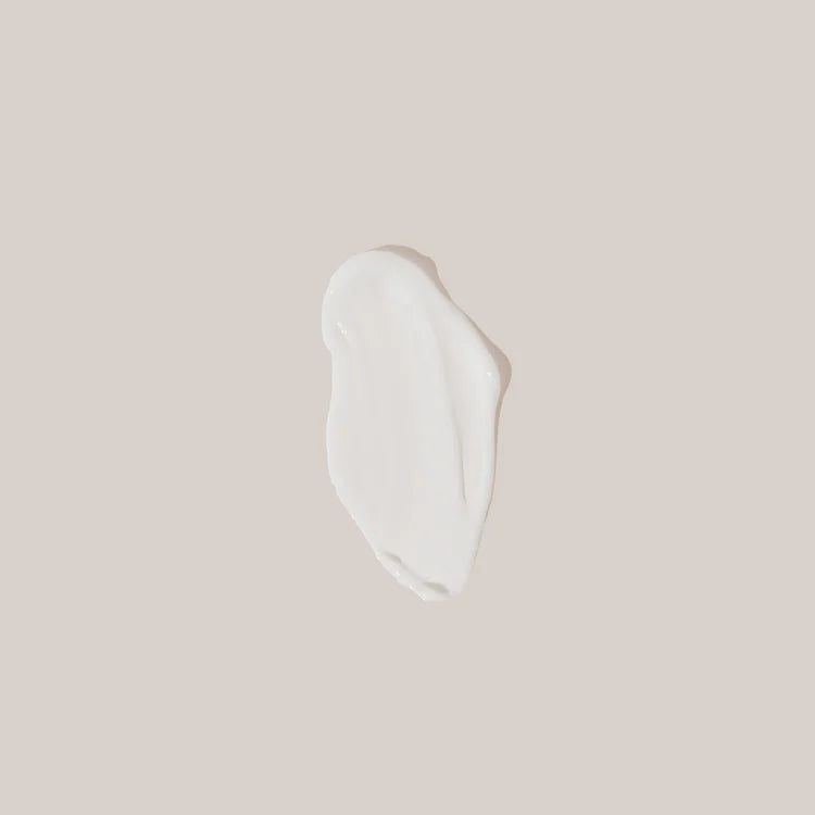 White cosmetic product on a beige background
