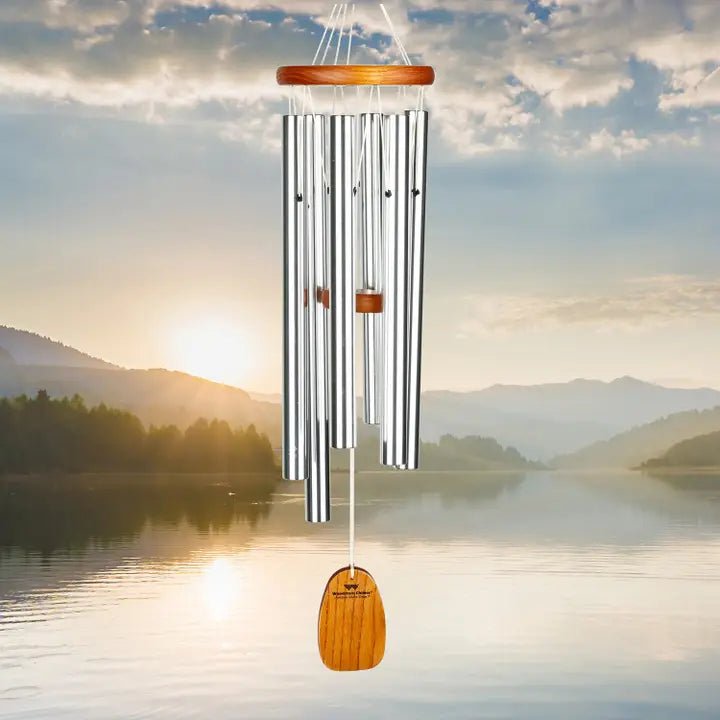 wind chime with a lake at sunset