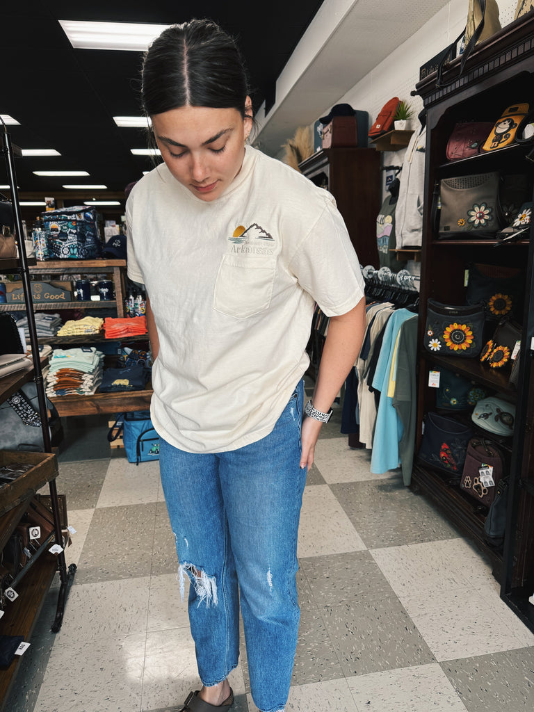 embroidered pocket tee being worn in a store