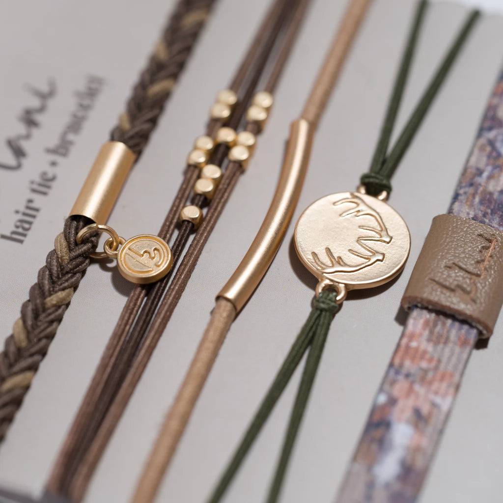 Close-up of hair ties with decorative ends on a light background