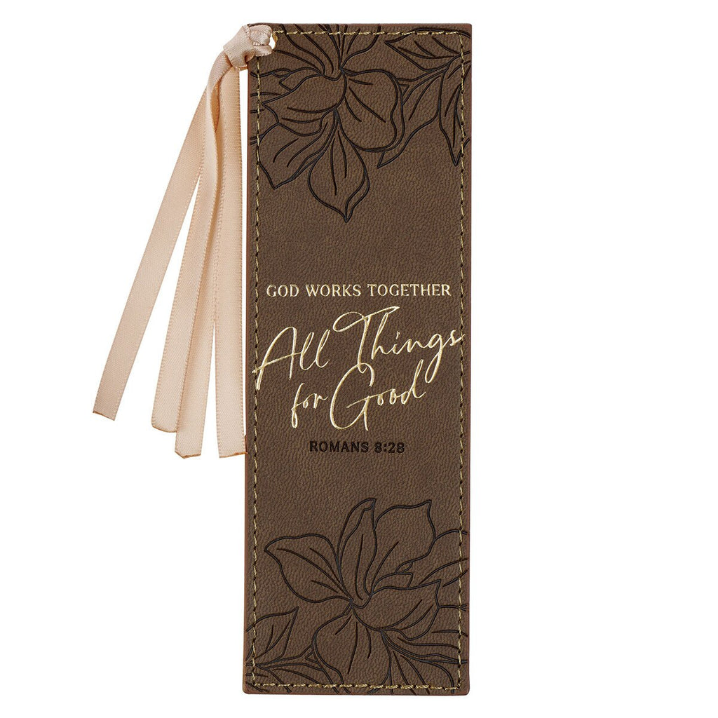 Brown leather bookmark with floral designs and text on a white background