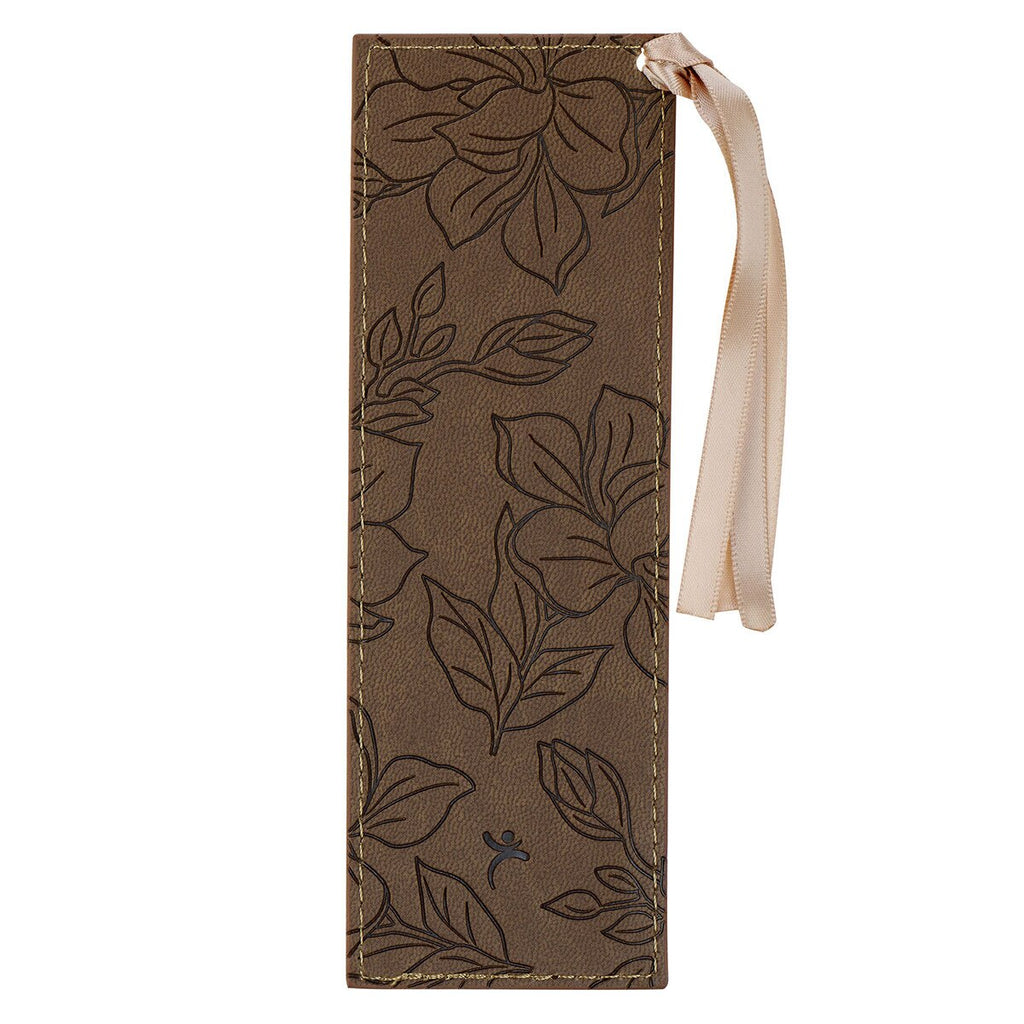 Brown floral embossed luggage tag with a strap on a white background