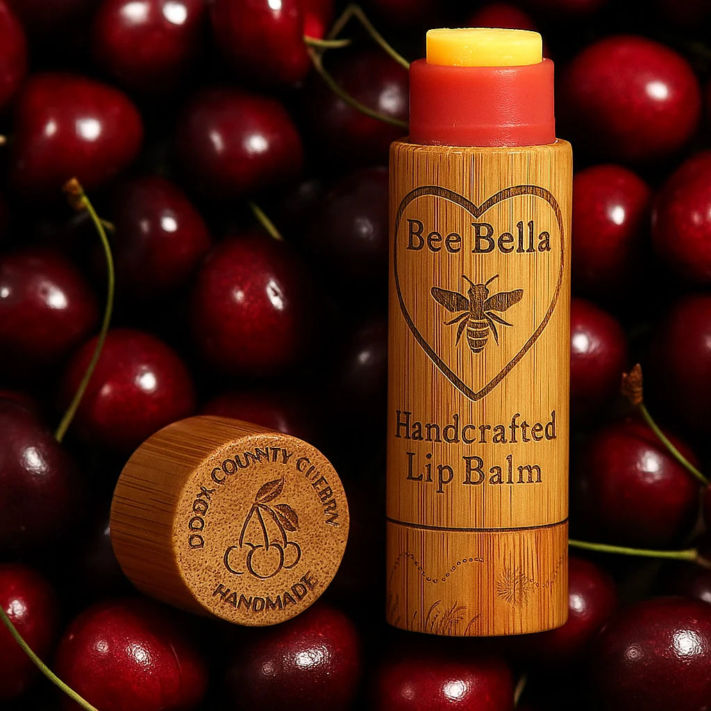 Bee Bella lip balm with wooden cap on a background of cherries