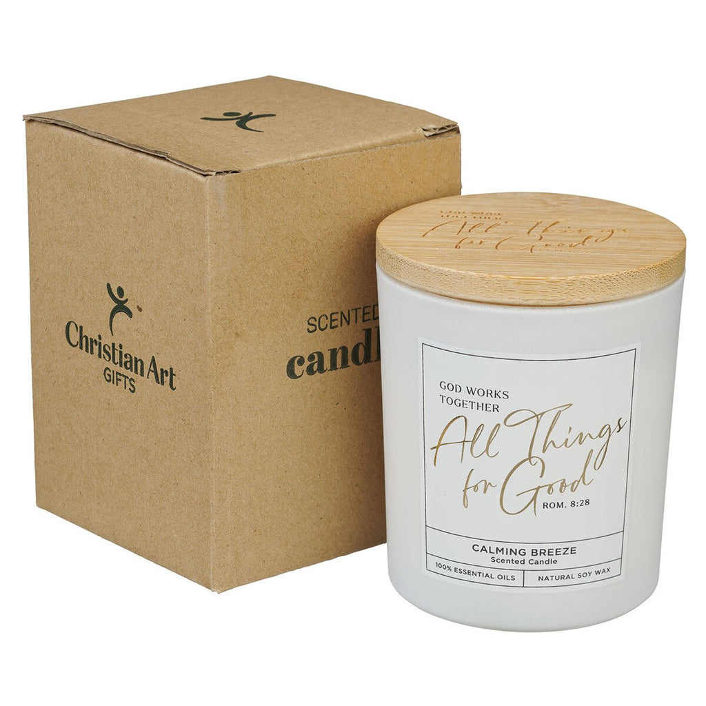 Scented candle with wooden lid and cardboard box labeled 'Christian Art Gifts' on a white background