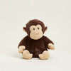 Stuffed monkey toy on a beige background