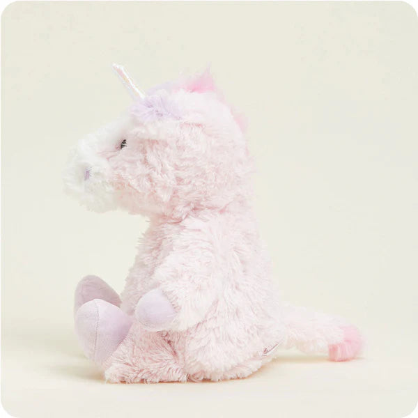 Pink plush toy on a light beige background