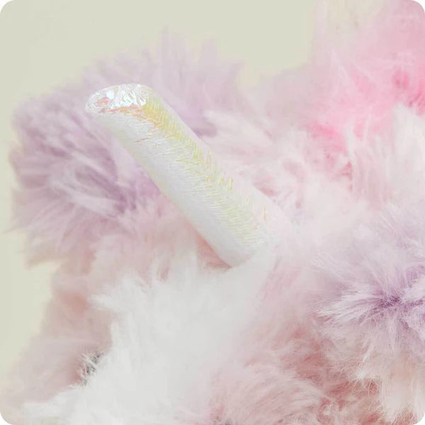 Close-up of a fluffy pink and white object with a soft, pastel background