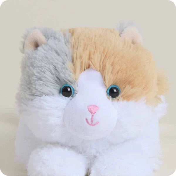 Plush toy resembling a cat with a white chest, gray back, and beige head on a light background
