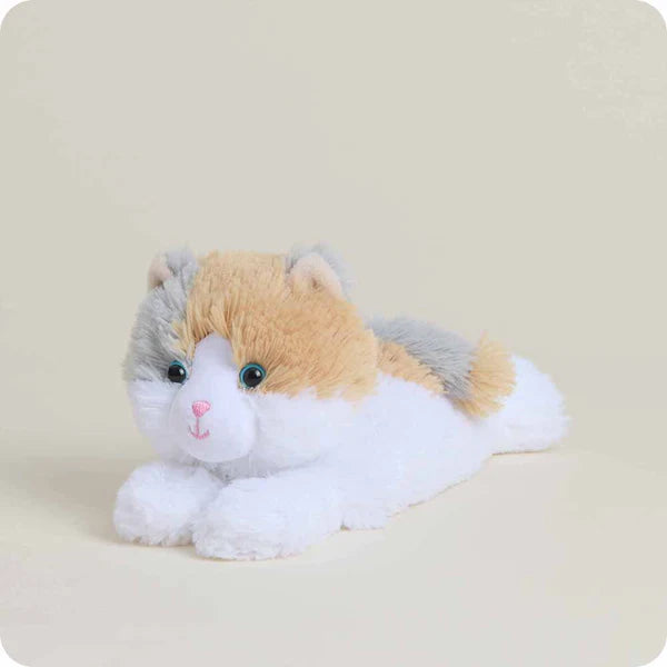 Plush toy resembling a cat with a beige, white, and gray color scheme on a light background