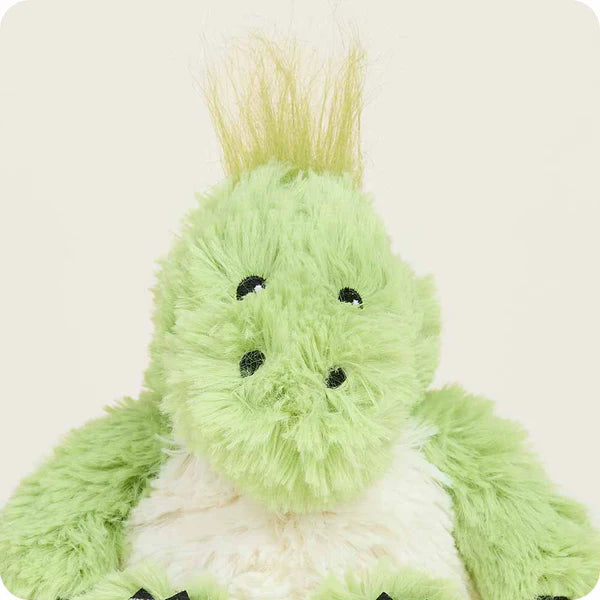 Green plush toy with a neutral background