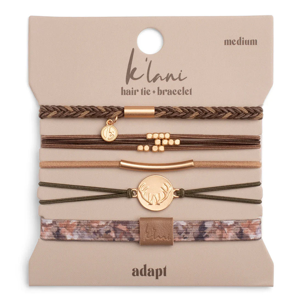 Set of hair ties and bracelets on a beige card with 'Klani' branding.