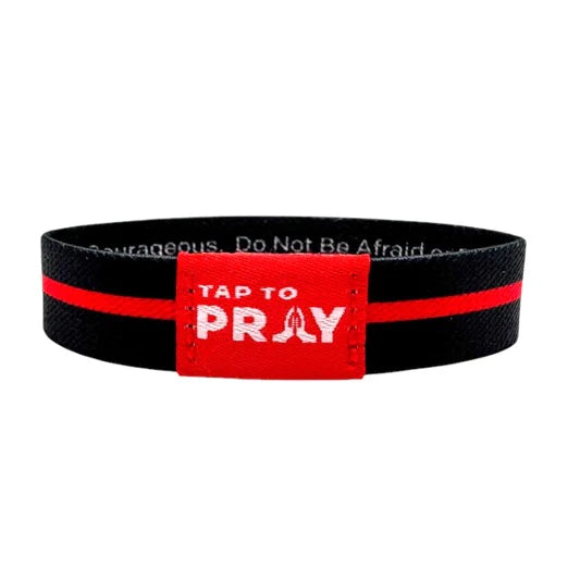Black wristband with a red label that says 'Tap to Pray' on a white background