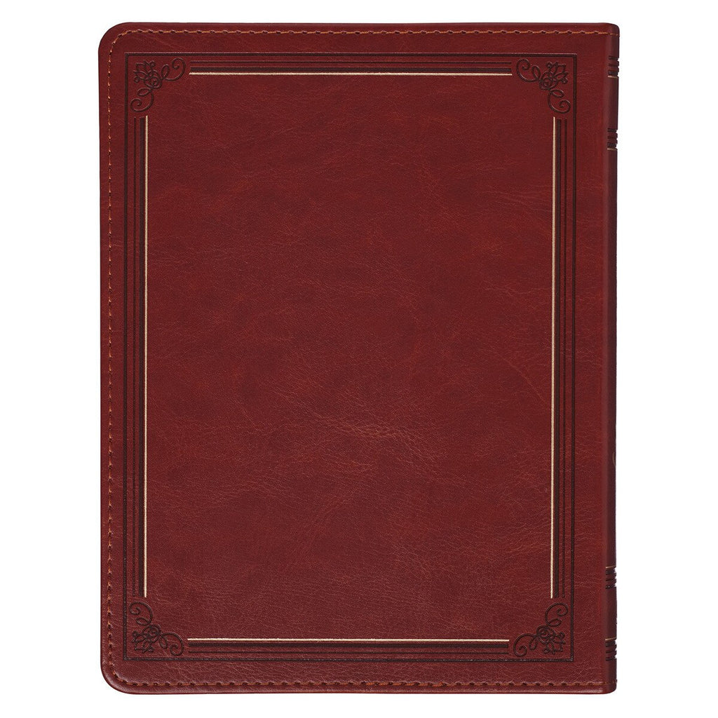 Red leather-bound book with decorative corners on a white background