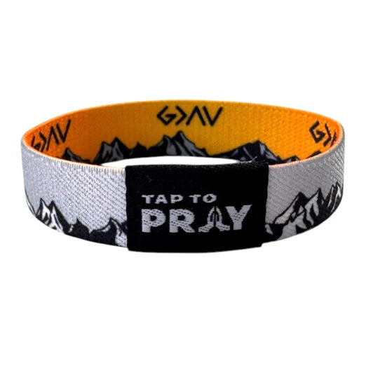 Wristband with mountain design and text on a white background