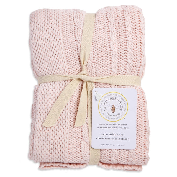 burts bee baby pink cable knit blanket on a white background