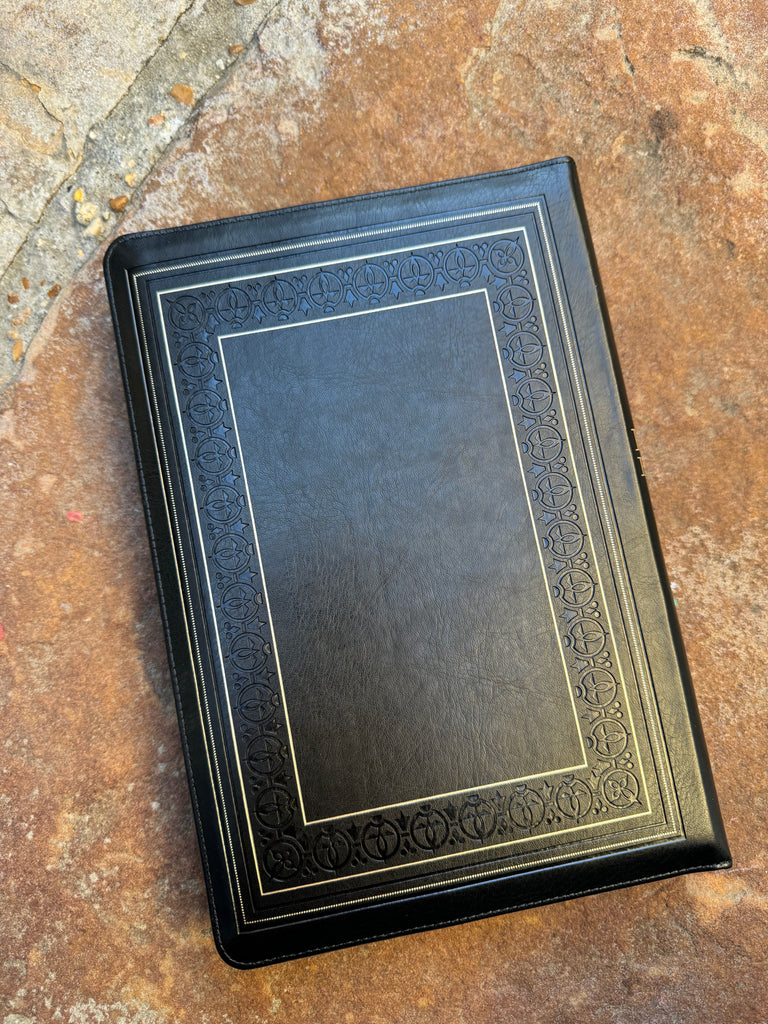 KJV Black Zipper Bible on a brown background