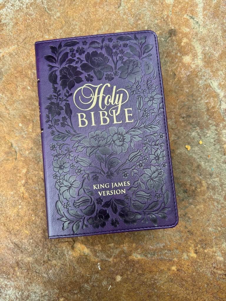 KJV Embossed Purple Floral & Gold Page Bible on a brown background