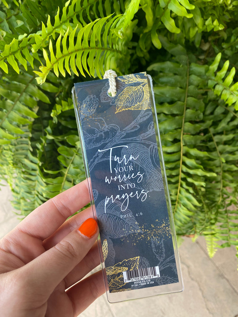 turn your worries bookmark on a green fern