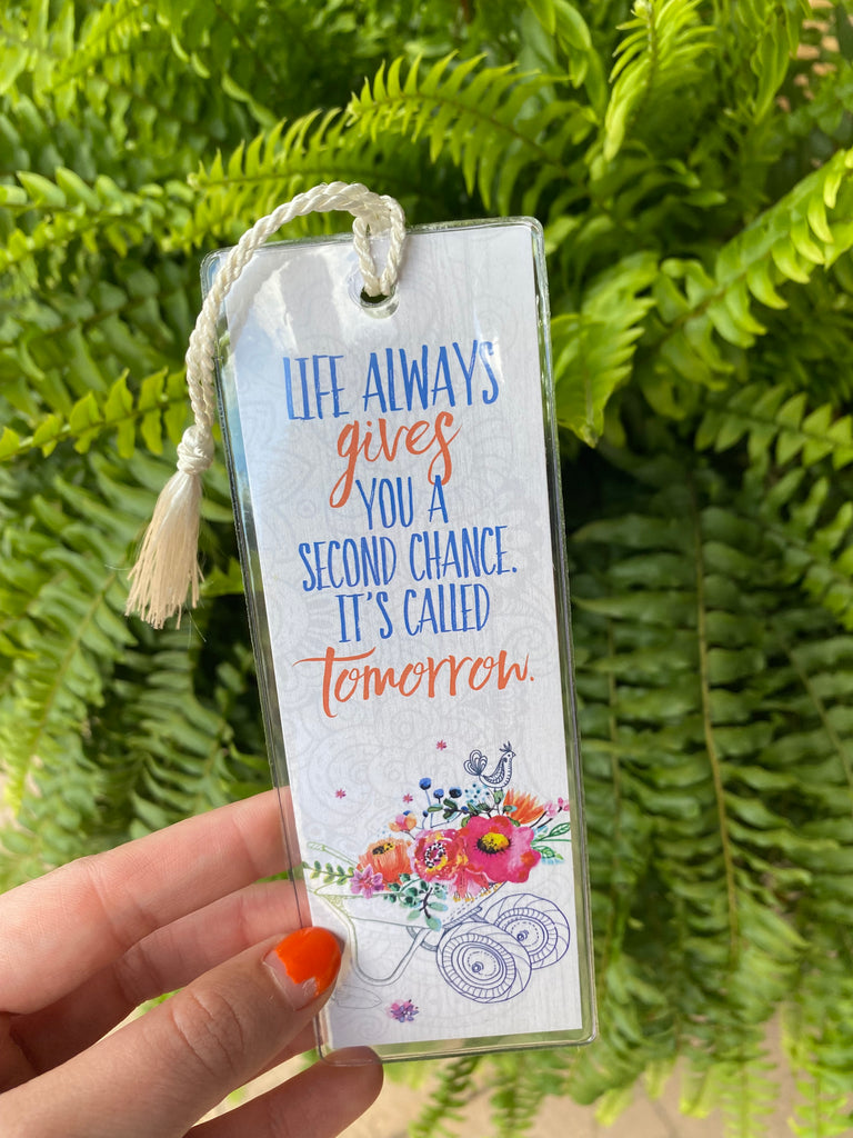 life always gives bookmark on a green fern 