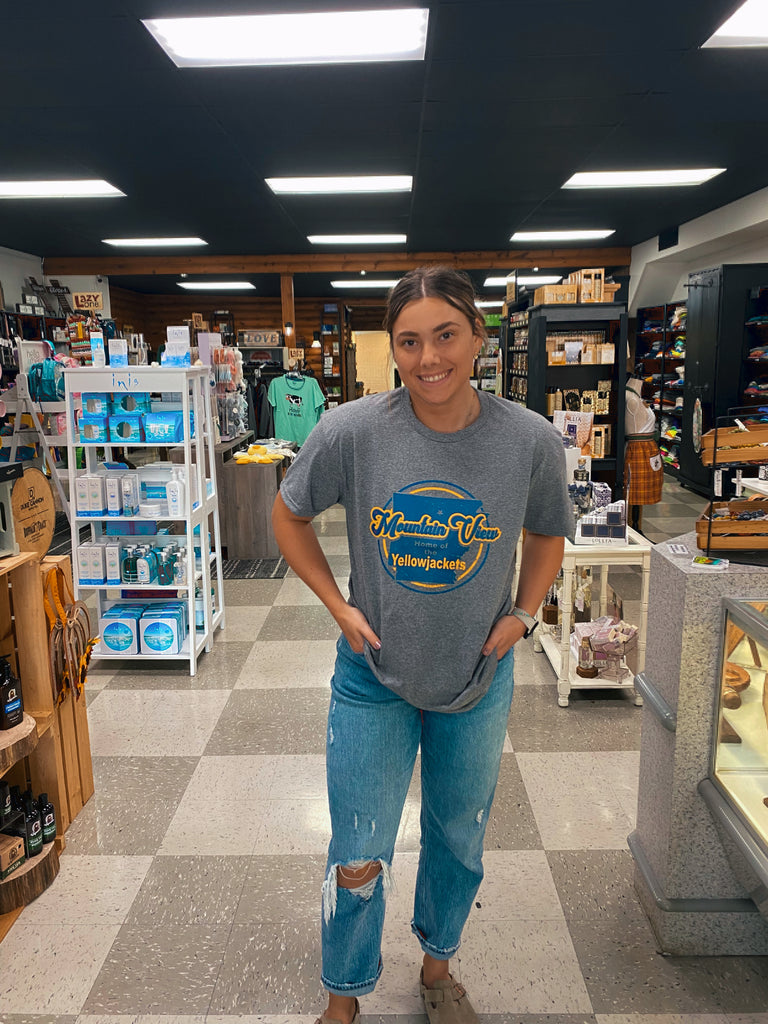 home of the yellow jackets tee being worn in a store