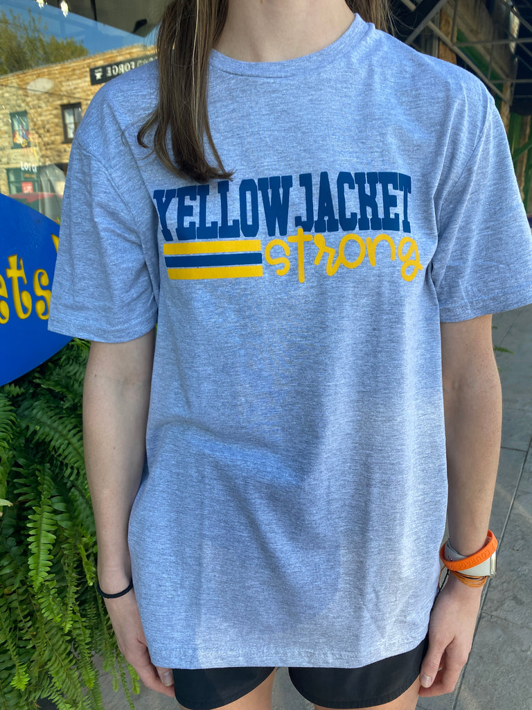 yellow jacket strong tee being worn in front of a fern