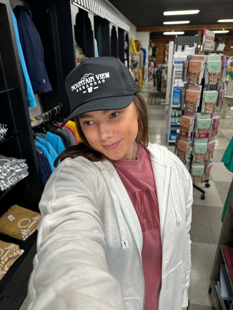 mountain view trucker hat being worn in a store