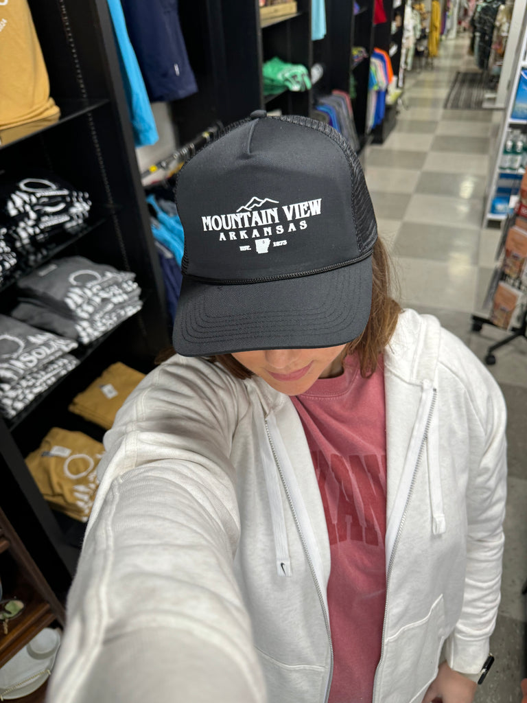 mountain view trucker hat being worn in a store