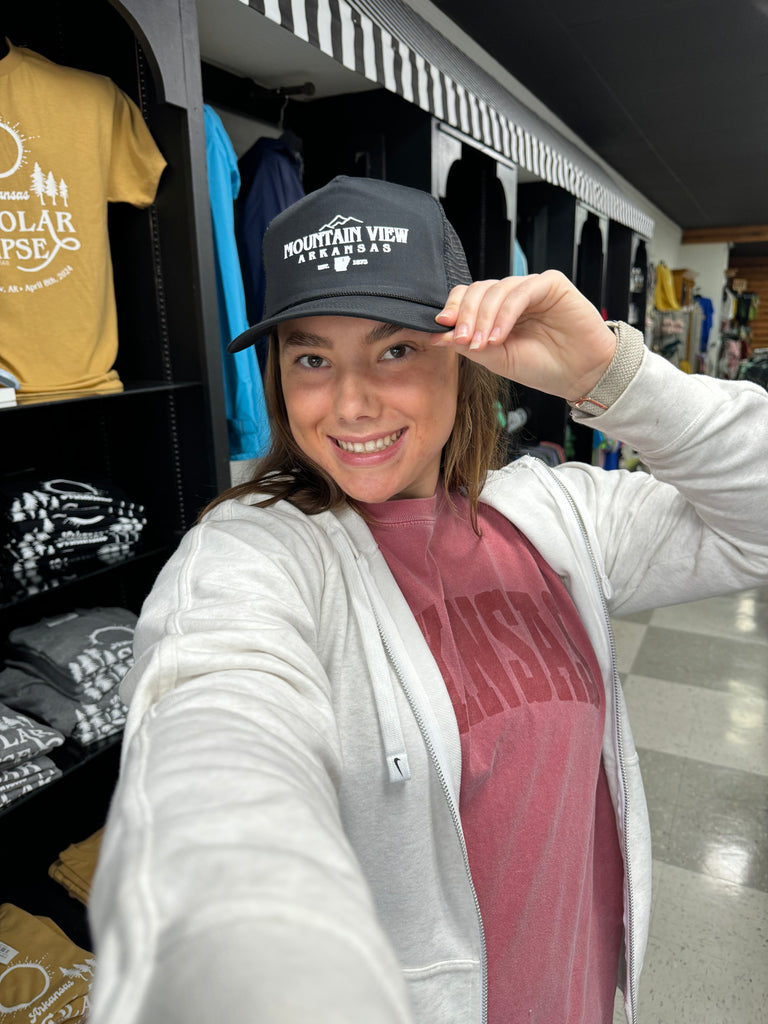 mountain view trucker hat being worn in a store
