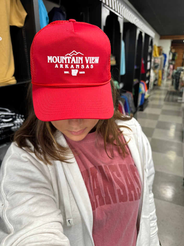 mountain view trucker hat being worn in a store