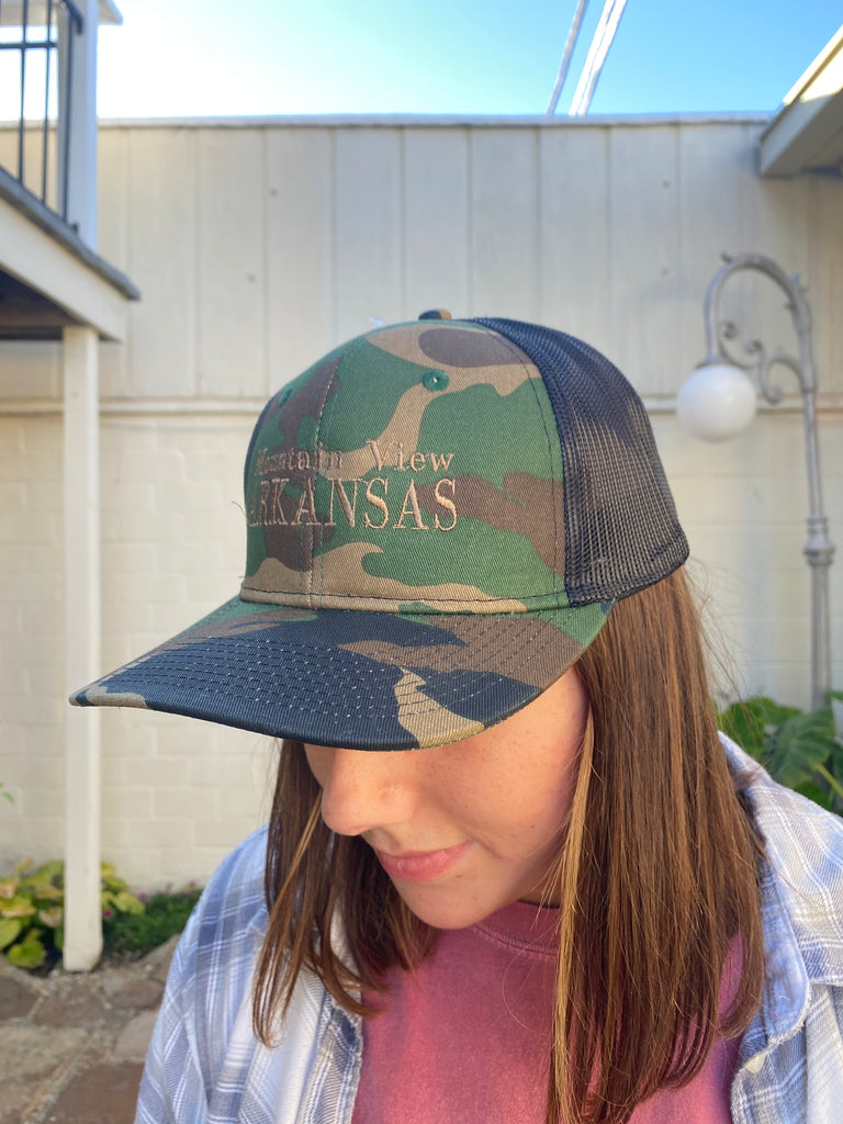 mountain view arkansas hat being worn in front of a white wall