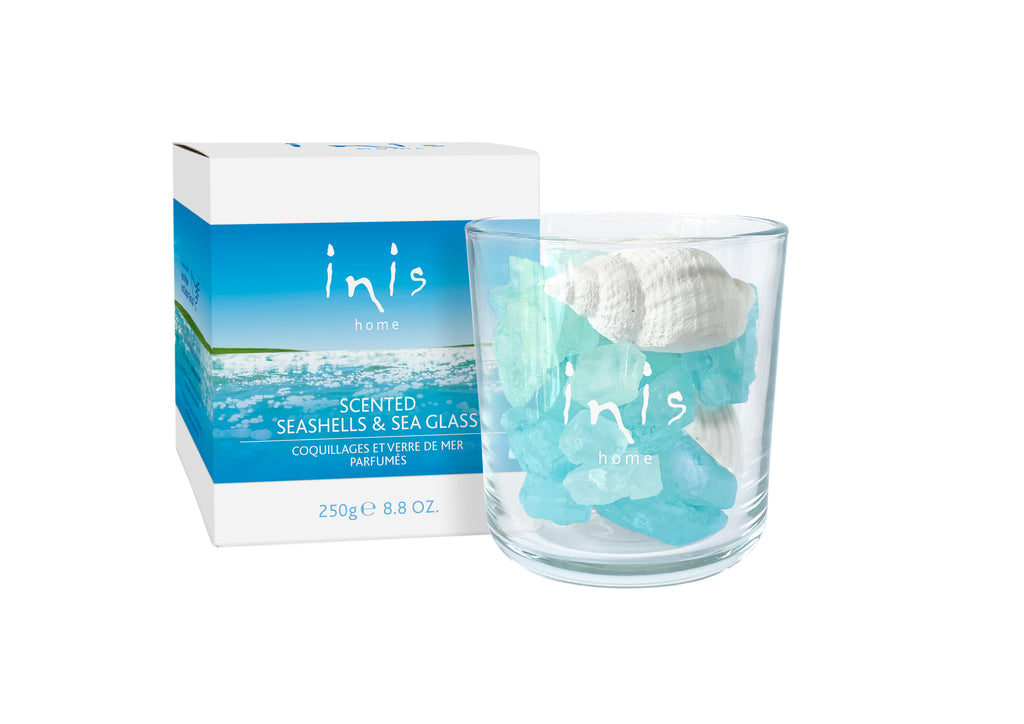 inis the energy of the sea scented seashells and sea glass on a white background