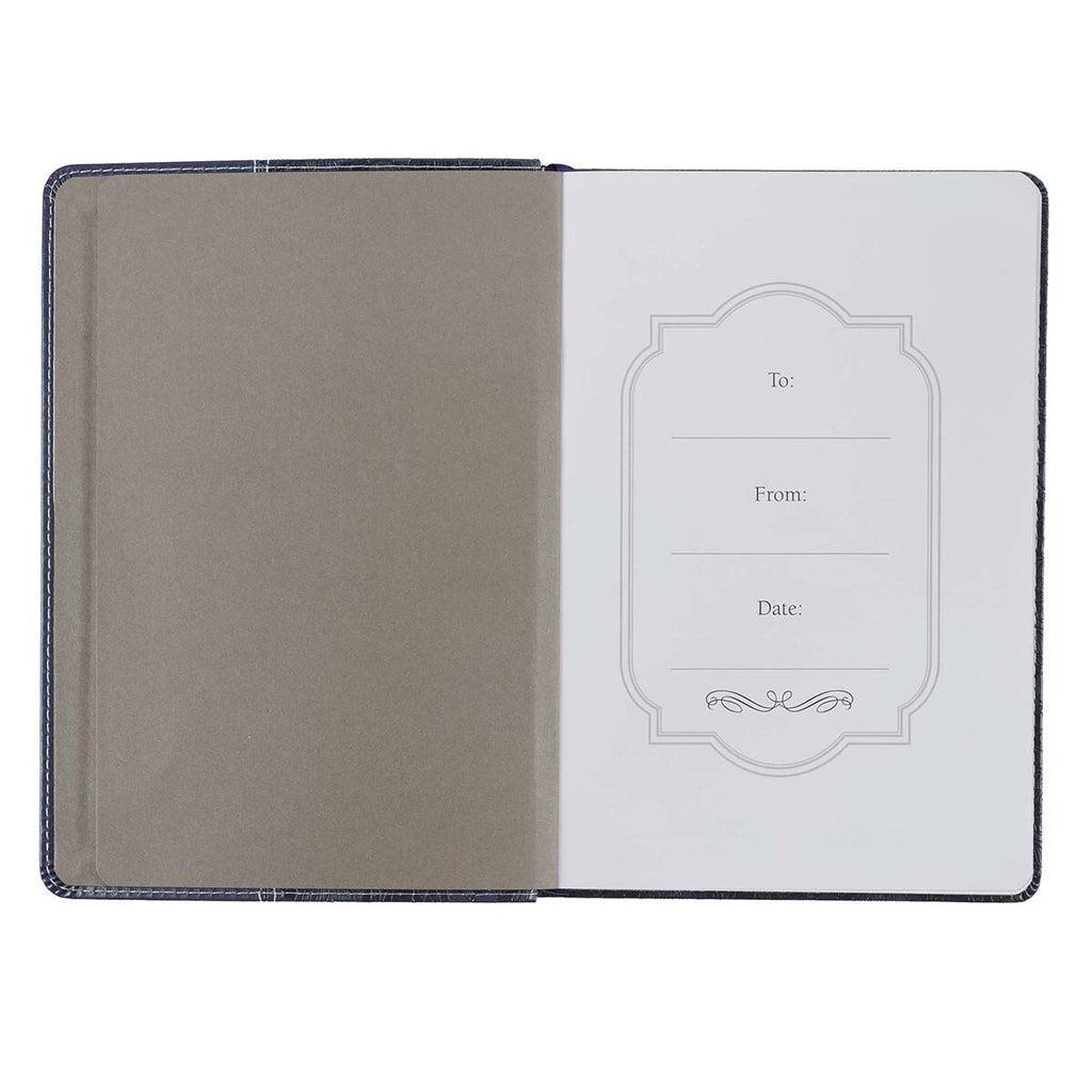 Open book with a greeting card inside on a white background