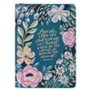 Floral notebook with inspirational quote on a blue background