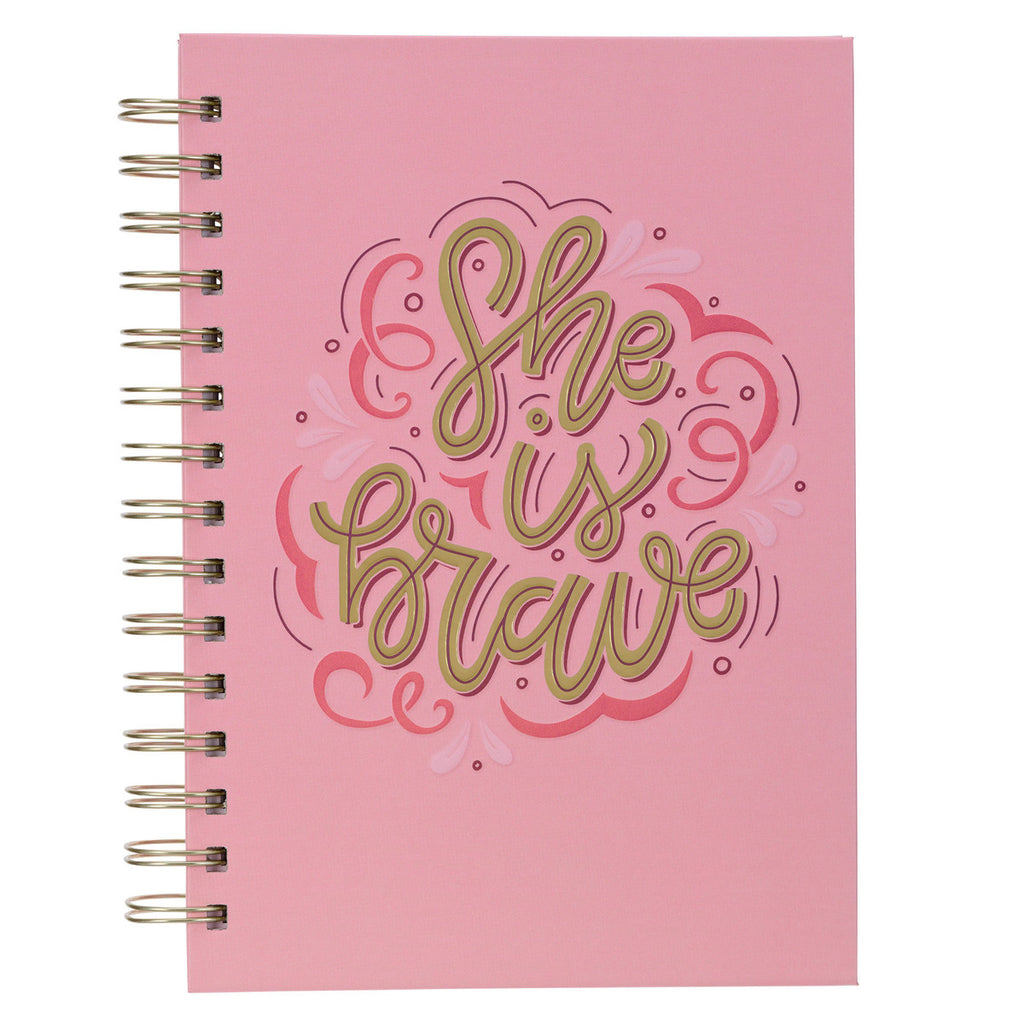 pink she is brave journal on a white background