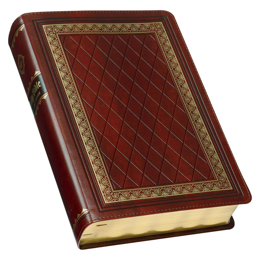 Decorative red book with gold embossed design on a white background